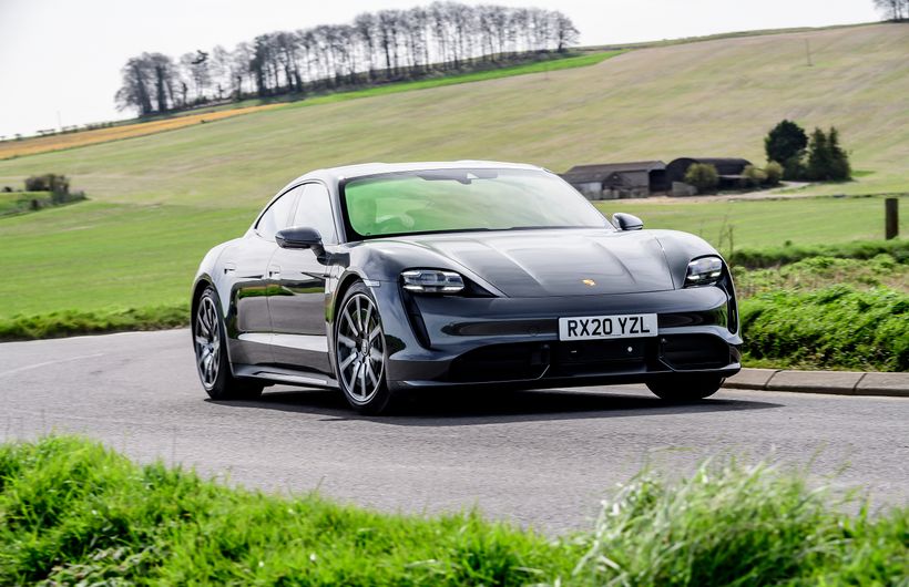 Grey Porsche Taycan turbo driving front