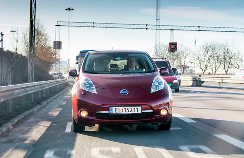 Red Nissan Leaf front driving