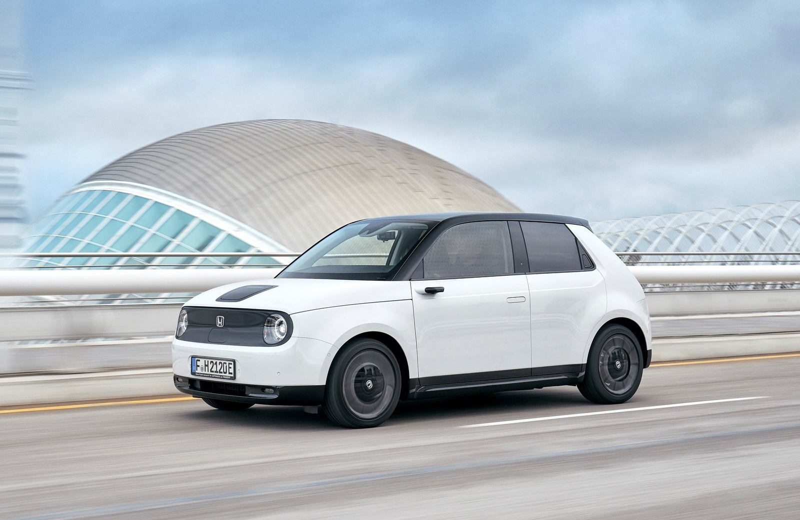 Honda e driving front and left side