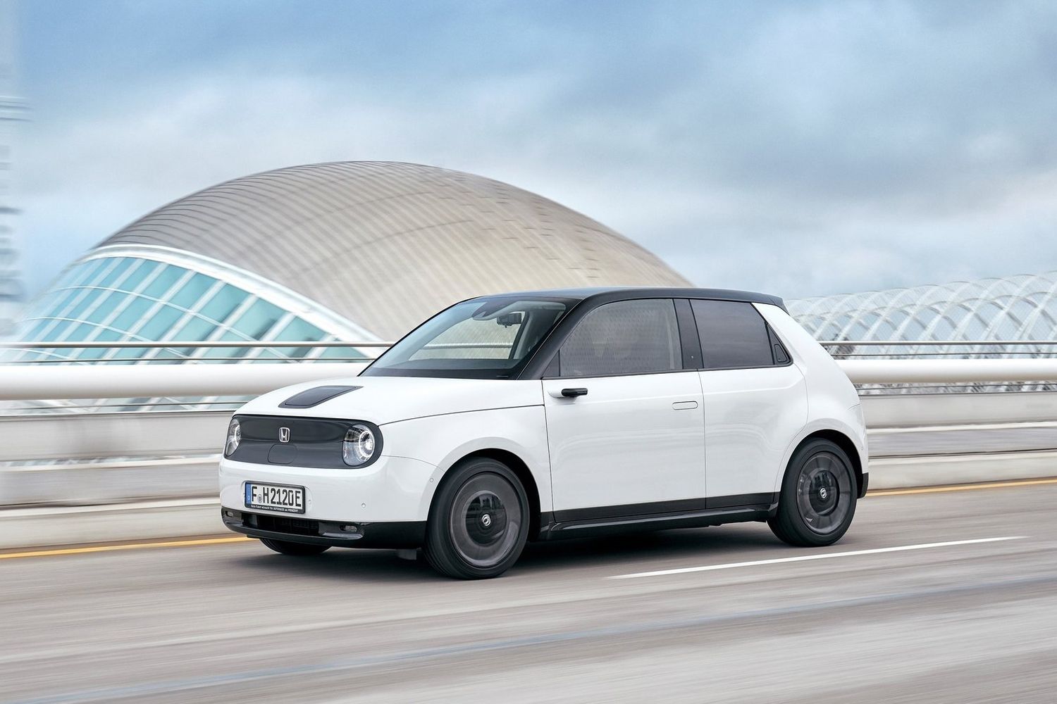 Honda e driving front and left side