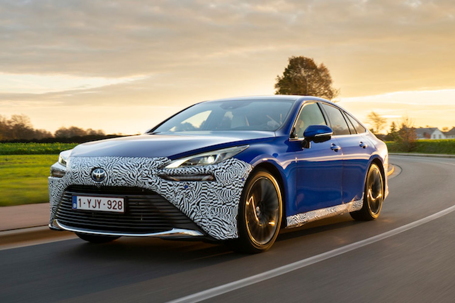 Toyota Mirai Hydrogen exterior front driving in country