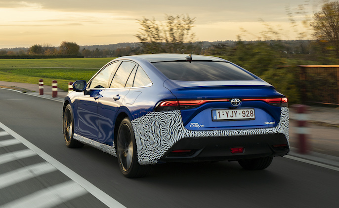 Toyota Mirai Hydrogen exterior rear driving in country