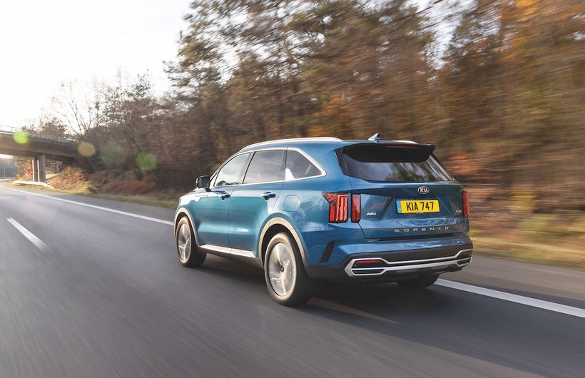 Kia Sorento PHEV exterior rear driving in country