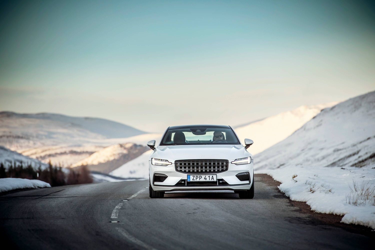 Polestar electric car exterior front driving in snow