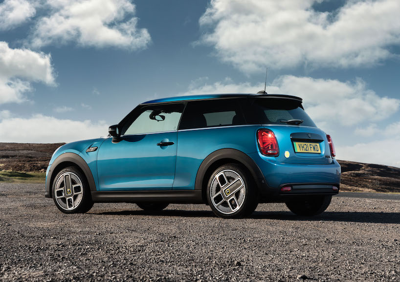 2021 MINI Electric rear tracking static shot, blue car, in countryside, parked on gravel