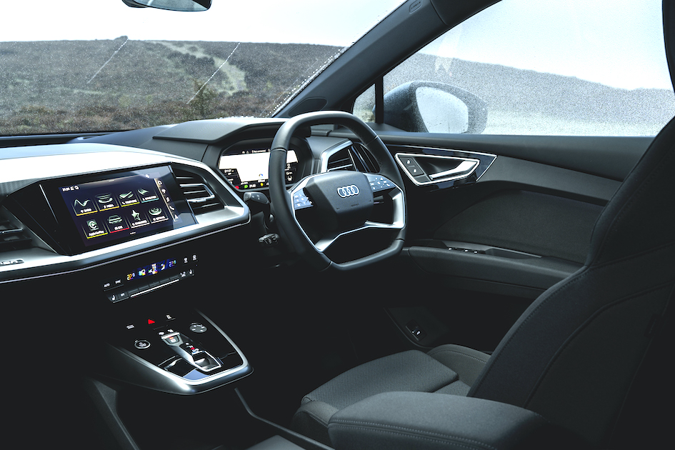Audi Q4 e-tron interior shot, dashboard and steering wheel, RHD