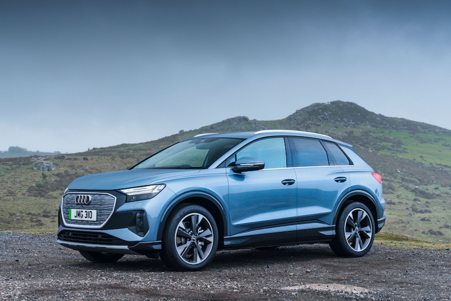 Audi Q4 e-tron front static shot, on gravel in countryside, blue/silver car, RHD, UK plates