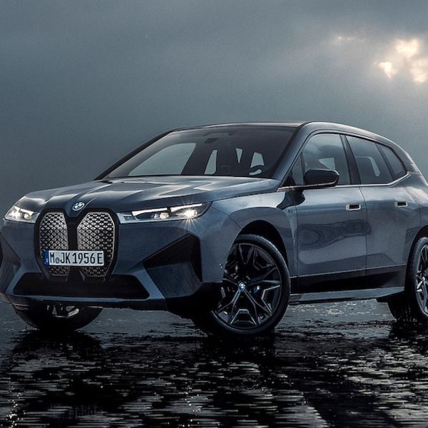 BMW iX M60, front three quarter shot on beach