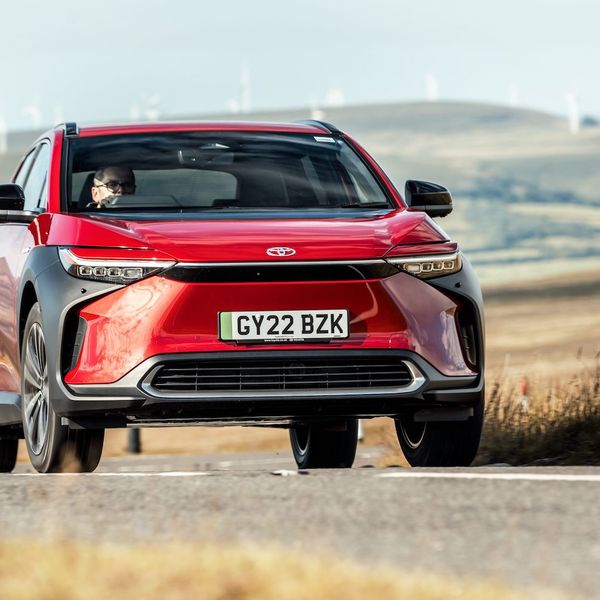 Toyota bZ4x action, front, red car, RHD UK registration