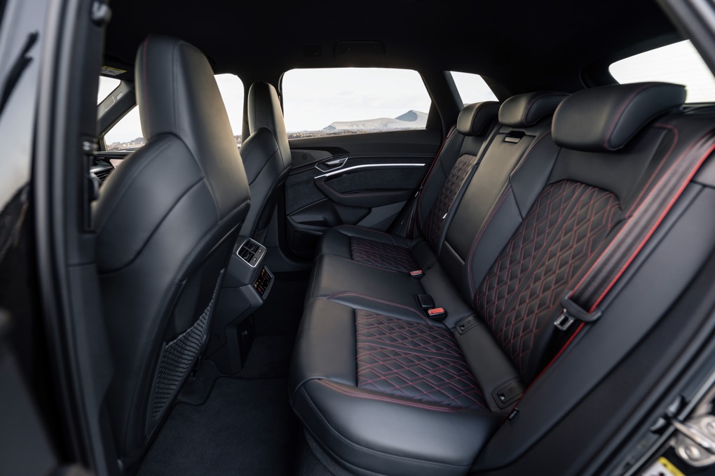 Audi Q8 e-tron rear interior, left hand drive car, black leather with red stitching