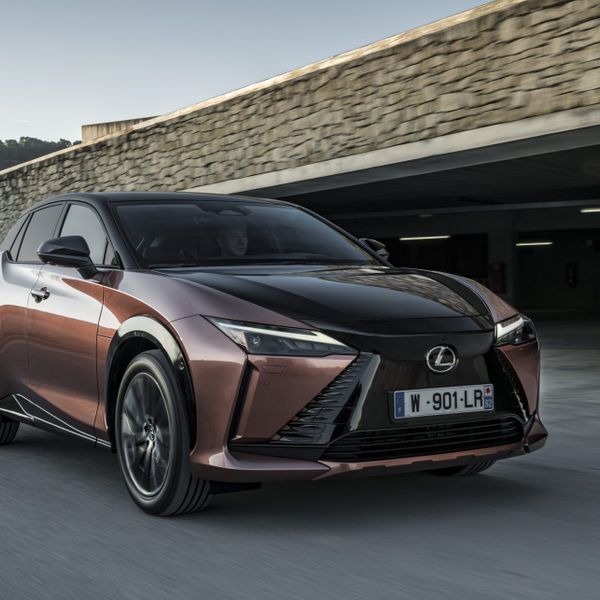 Lexus RZ 450e, front action by building, two tone copper/black, French registration